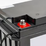 Detail of the red positive terminal of a 12V 24V lithium-ion battery